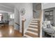 Elegant staircase with wooden railings and views to dining room at 2134 Old Georgian Nw Ter, Atlanta, GA 30318