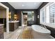 Luxurious bathroom with soaking tub, walk-in shower, and double vanity at 5220 Green Oak Ct, Atlanta, GA 30327