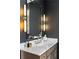 Elegant bathroom with marble vanity and modern light fixtures at 5220 Green Oak Ct, Atlanta, GA 30327