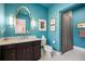 Stylish bathroom with a teal accent wall and marble vanity at 5220 Green Oak Ct, Atlanta, GA 30327