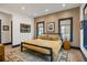 Comfortable bedroom with a king-size bed, wood floors, and large windows at 5220 Green Oak Ct, Atlanta, GA 30327