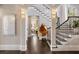 Bright entryway with hardwood floors and a dramatic staircase at 5220 Green Oak Ct, Atlanta, GA 30327