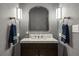 Modern powder room with dark vanity and updated fixtures at 5220 Green Oak Ct, Atlanta, GA 30327