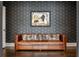 Sitting room with a leather sofa and geometric wallpaper at 5220 Green Oak Ct, Atlanta, GA 30327