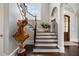 Elegant staircase with dark wood and iron railings at 5220 Green Oak Ct, Atlanta, GA 30327