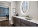 Butler's pantry with dark cabinetry, marble countertops, and a sink at 5220 Green Oak Ct, Atlanta, GA 30327