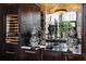 Elegant wine room featuring a built-in wine cooler and marble countertops at 5220 Green Oak Ct, Atlanta, GA 30327