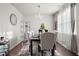 Formal dining room with hardwood floors, chandelier, and seating for six at 1508 Denver Way, Locust Grove, GA 30248