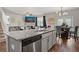 Modern kitchen with granite countertops, stainless steel appliances, and island at 1508 Denver Way, Locust Grove, GA 30248