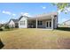 Large backyard with covered patio and grassy lawn at 427 Bluffs View Ln, Canton, GA 30114