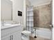 Bathroom boasts a shower/tub combo and white vanity at 427 Bluffs View Ln, Canton, GA 30114