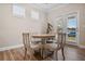 Bright dining area with French doors leading to backyard at 427 Bluffs View Ln, Canton, GA 30114