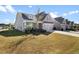 House exterior, landscaped yard, and driveway at 427 Bluffs View Ln, Canton, GA 30114