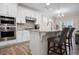 Modern kitchen with white cabinets, granite, and stainless steel appliances at 427 Bluffs View Ln, Canton, GA 30114