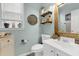 Charming bathroom with a white vanity and rustic mirror at 615 Keeneland Ter, Woodstock, GA 30189