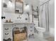 Elegant bathroom with a unique vanity and white subway tile at 615 Keeneland Ter, Woodstock, GA 30189