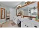 Elegant bathroom boasting a double vanity and stylish mirror at 615 Keeneland Ter, Woodstock, GA 30189