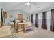 Bright bedroom featuring a metal bed frame and decorative pillows at 615 Keeneland Ter, Woodstock, GA 30189