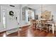 Farmhouse style dining room featuring a wooden table and hardwood floors at 615 Keeneland Ter, Woodstock, GA 30189