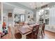 Farmhouse-style dining room with hardwood floors and a large window at 615 Keeneland Ter, Woodstock, GA 30189