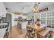 Bright eat-in kitchen with an island and white cabinetry at 615 Keeneland Ter, Woodstock, GA 30189