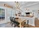 Kitchen features a farmhouse table and opens to the Gathering room at 615 Keeneland Ter, Woodstock, GA 30189