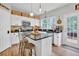 White kitchen with granite countertops and stainless steel appliances at 615 Keeneland Ter, Woodstock, GA 30189