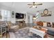 Spacious living room with a neutral color scheme, featuring a large sectional sofa at 615 Keeneland Ter, Woodstock, GA 30189