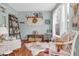 Cozy living room with a rustic feel, featuring a cowhide rug and comfy seating at 615 Keeneland Ter, Woodstock, GA 30189