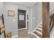 Bright stairwell with wood accents and gray walls at 615 Keeneland Ter, Woodstock, GA 30189