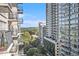 City view from balcony of lush treetops and surrounding buildings at 195 14Th Ne St # 902, Atlanta, GA 30309