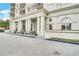 Elegant building exterior featuring white columns, arched windows, and manicured landscaping at 195 14Th Ne St # 902, Atlanta, GA 30309