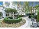 Beautiful courtyard with manicured bushes, a stone fountain, seating and well-maintained landscaping at 195 14Th Ne St # 902, Atlanta, GA 30309