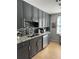 Modern kitchen with granite countertops, stainless steel appliances, and stylish tile backsplash at 195 14Th Ne St # 902, Atlanta, GA 30309