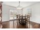 Bright dining room with french doors to the back, modern light fixture, and a table for four at 2729 Joyce Ave, Decatur, GA 30032