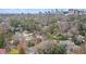 An aerial view of the neighborhood shows mature trees and city skyline in the background at 7 W Andrews Nw Dr, Atlanta, GA 30305