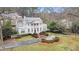 Elegant estate with a circular driveway, lush landscaping, and a grand facade at 7 W Andrews Nw Dr, Atlanta, GA 30305