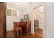 Charming bar area with a vintage wooden bar, chair, hardwood floors, and stairs view at 7 W Andrews Nw Dr, Atlanta, GA 30305