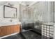 Modern bathroom featuring a walk-in shower, unique tiles, and stylish vanity at 7 W Andrews Nw Dr, Atlanta, GA 30305