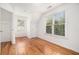 Bright and airy bedroom featuring hardwood floors and natural light through the windows at 7 W Andrews Nw Dr, Atlanta, GA 30305