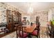 This dining room features a chandelier, patterned wallpaper, and a large wooden hutch at 7 W Andrews Nw Dr, Atlanta, GA 30305