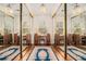 Dressing room with mirrored closets, hardwood floors, vanity and ample storage at 7 W Andrews Nw Dr, Atlanta, GA 30305