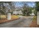 Long, paved driveway leading to a distinguished home with mature trees at 7 W Andrews Nw Dr, Atlanta, GA 30305