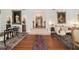 Inviting foyer with hardwood floors, elegant furnishings, and a grand staircase at 7 W Andrews Nw Dr, Atlanta, GA 30305