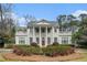 Stately white home featuring a columned entrance and manicured landscaping at 7 W Andrews Nw Dr, Atlanta, GA 30305
