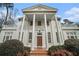 Classic home showcasing impressive columns and a welcoming entrance at 7 W Andrews Nw Dr, Atlanta, GA 30305