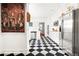 Updated kitchen with black-and-white checkered floors and stainless steel appliances at 7 W Andrews Nw Dr, Atlanta, GA 30305
