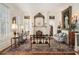 Sophisticated living room with ornate fireplace, hardwood floors, and natural light at 7 W Andrews Nw Dr, Atlanta, GA 30305