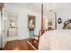 This charming main bedroom features a chandelier, wood floors, and ensuite bath access at 7 W Andrews Nw Dr, Atlanta, GA 30305