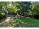 Large backyard featuring mature trees, lawn and a privacy fence at 2220 Edison Ave, Atlanta, GA 30305